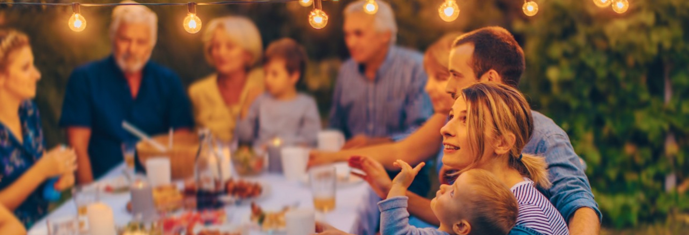 constellation family mom and son at a family table pointing at a bulb